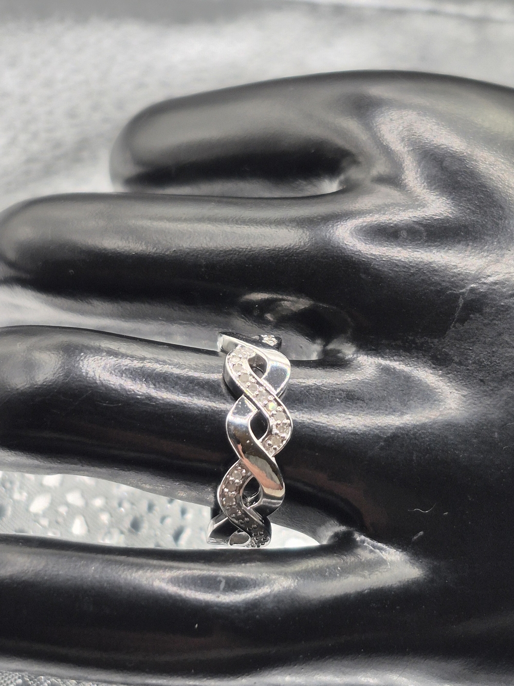 Sterling Silver Twisted Infinity Ring with Diamond Stones